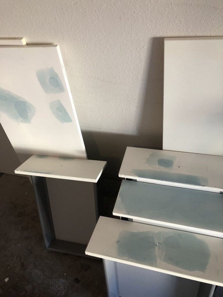 Cabinet doors sanded and patched before priming