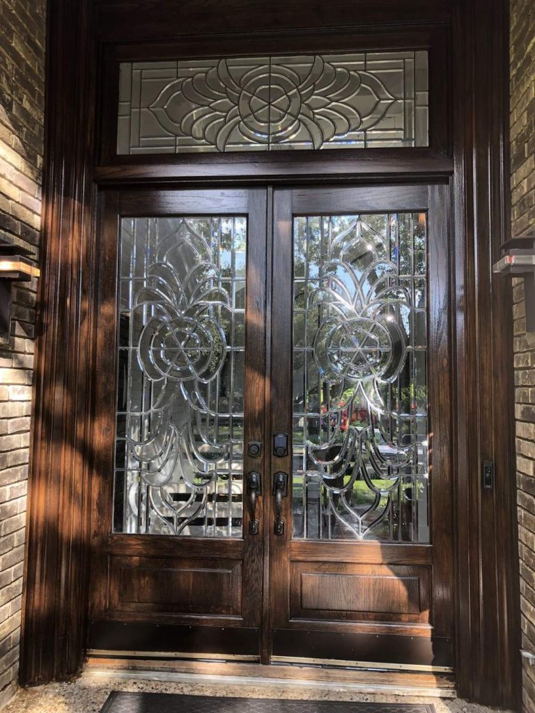 Refinished dark stained wood double front doors with glass